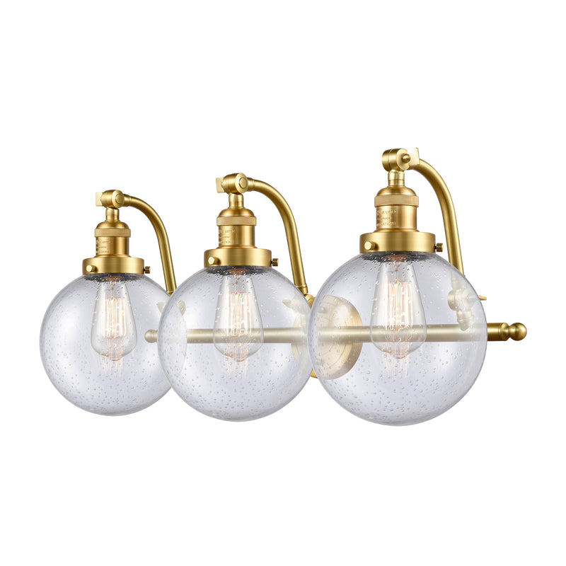 Beacon Bath Vanity Light shown in the Satin Gold finish with a Seedy shade