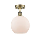 Athens Semi-Flush Mount shown in the Antique Brass finish with a Matte White shade