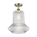 Springwater Semi-Flush Mount shown in the Antique Brass finish with a Clear Spiral Fluted shade