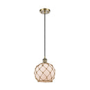 Farmhouse Rope Mini Pendant shown in the Antique Brass finish with a White Glass with Brown Rope shade