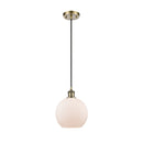 Athens Mini Pendant shown in the Antique Brass finish with a Matte White shade