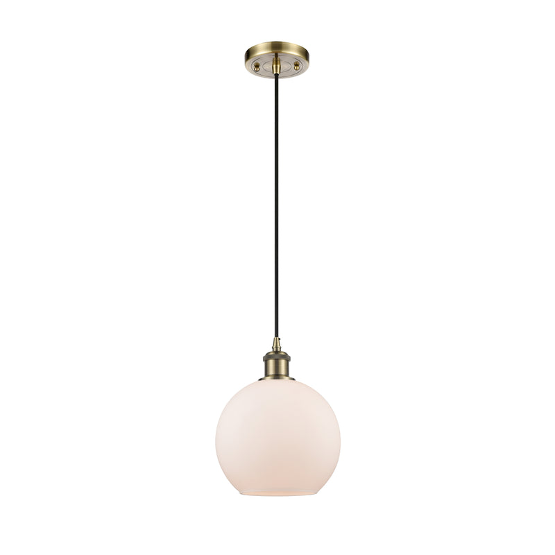 Athens Mini Pendant shown in the Antique Brass finish with a Matte White shade