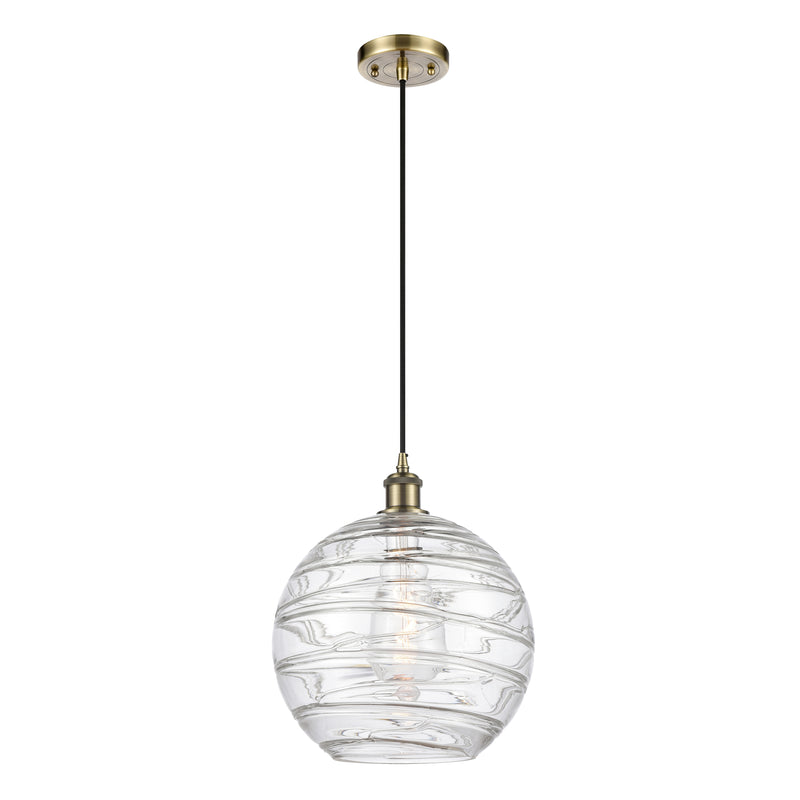 Deco Swirl Mini Pendant shown in the Antique Brass finish with a Clear shade