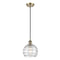 Deco Swirl Mini Pendant shown in the Antique Brass finish with a Clear shade