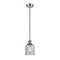 Caledonia Mini Pendant shown in the Antique Brass finish with a Charcoal shade