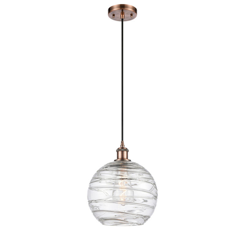 Deco Swirl Mini Pendant shown in the Antique Copper finish with a Clear shade