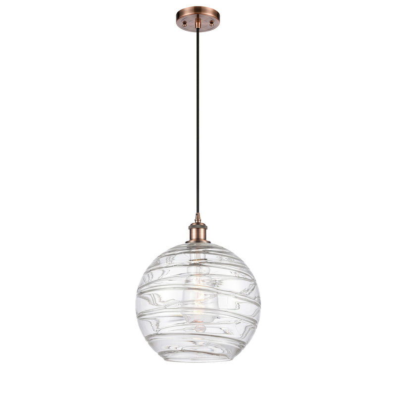 Deco Swirl Mini Pendant shown in the Antique Copper finish with a Clear shade