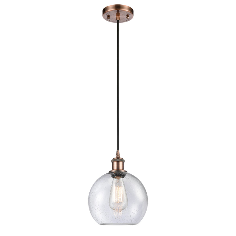 Athens Mini Pendant shown in the Antique Copper finish with a Seedy shade