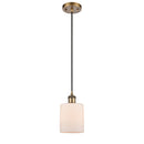 Cobbleskill Mini Pendant shown in the Brushed Brass finish with a Matte White shade