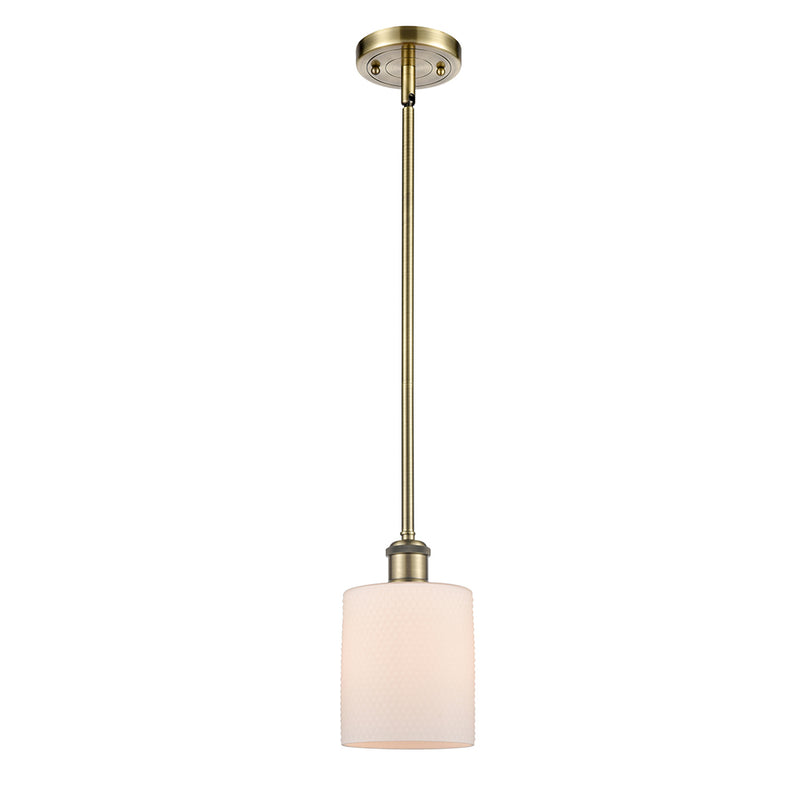 Cobbleskill Mini Pendant shown in the Antique Brass finish with a Matte White shade