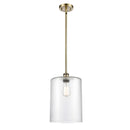 Cobbleskill Mini Pendant shown in the Antique Brass finish with a Clear shade