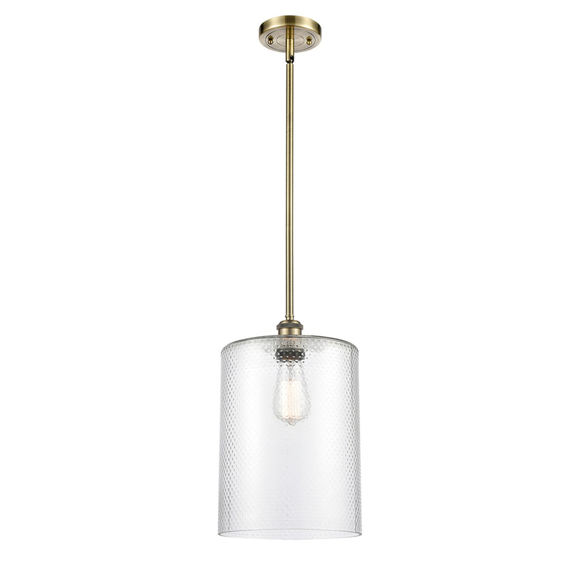 Cobbleskill Mini Pendant shown in the Antique Brass finish with a Clear shade