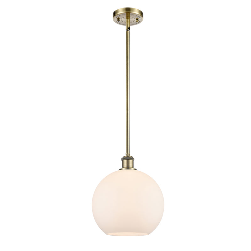 Athens Mini Pendant shown in the Antique Brass finish with a Matte White shade