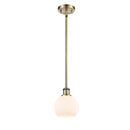 Athens Mini Pendant shown in the Antique Brass finish with a Matte White shade