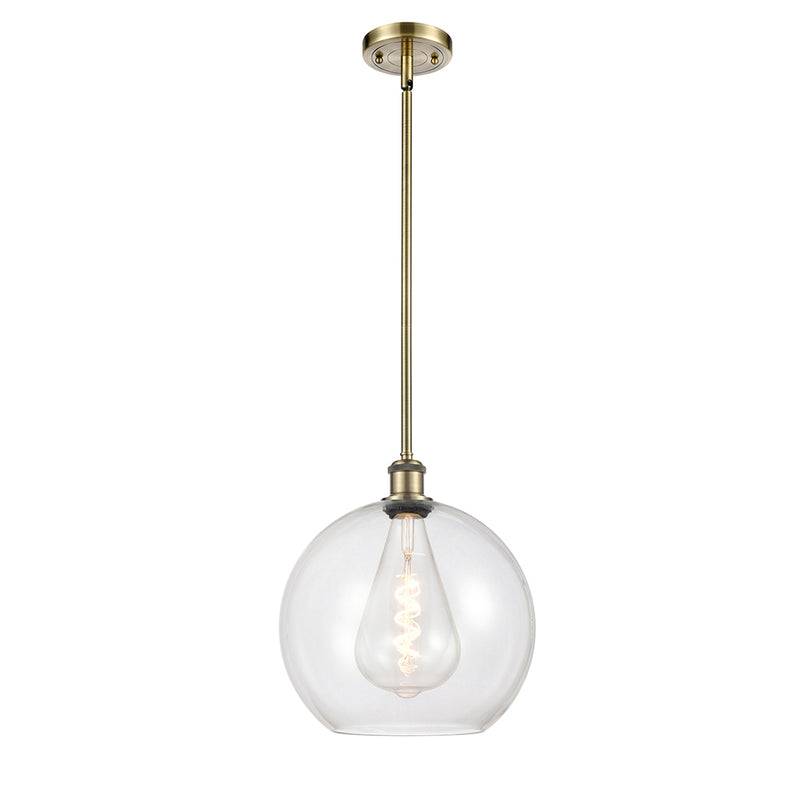 Athens Mini Pendant shown in the Antique Brass finish with a Clear shade