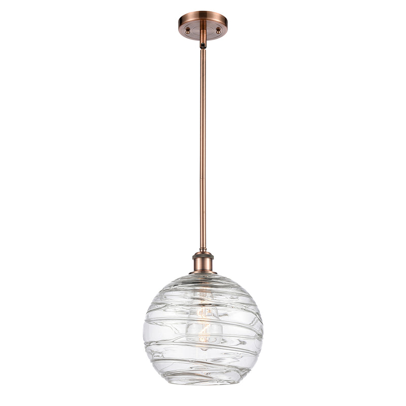 Deco Swirl Mini Pendant shown in the Antique Copper finish with a Clear shade