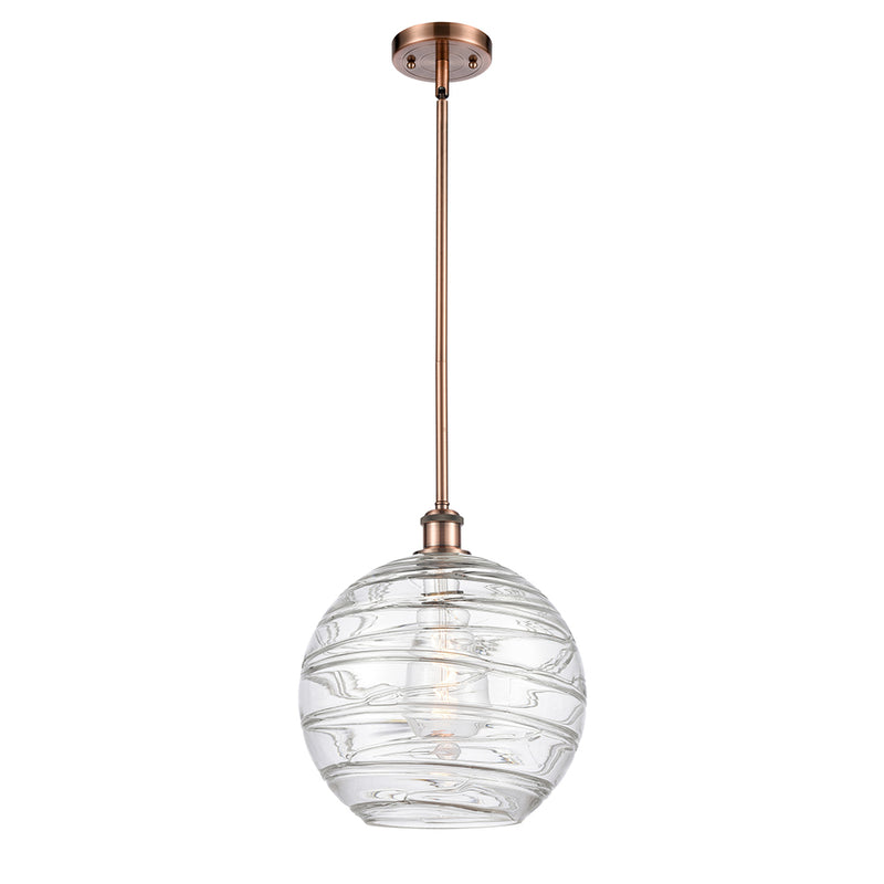 Deco Swirl Mini Pendant shown in the Antique Copper finish with a Clear shade