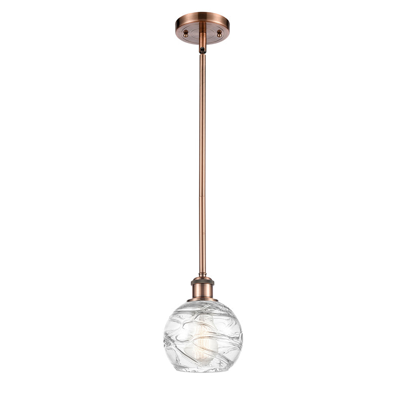 Deco Swirl Mini Pendant shown in the Antique Copper finish with a Clear shade