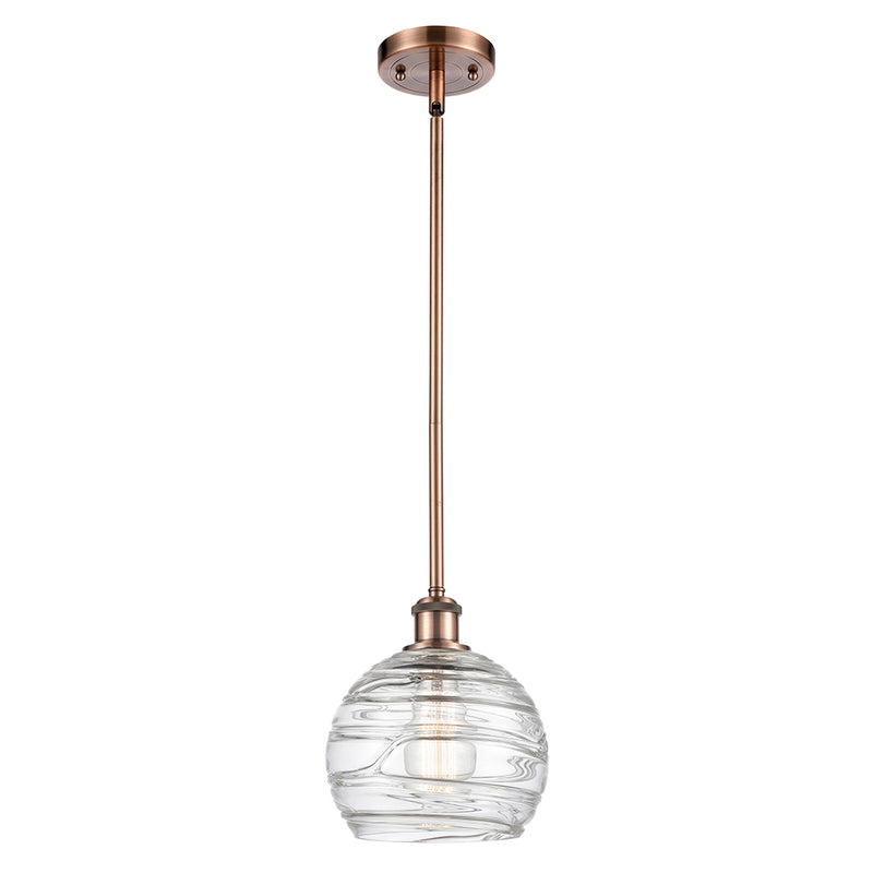 Deco Swirl Mini Pendant shown in the Antique Copper finish with a Clear shade