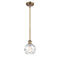 Deco Swirl Mini Pendant shown in the Brushed Brass finish with a Clear shade