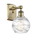 Deco Swirl Sconce shown in the Antique Brass finish with a Clear shade