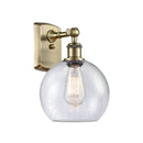 Athens Sconce shown in the Antique Brass finish with a Seedy shade