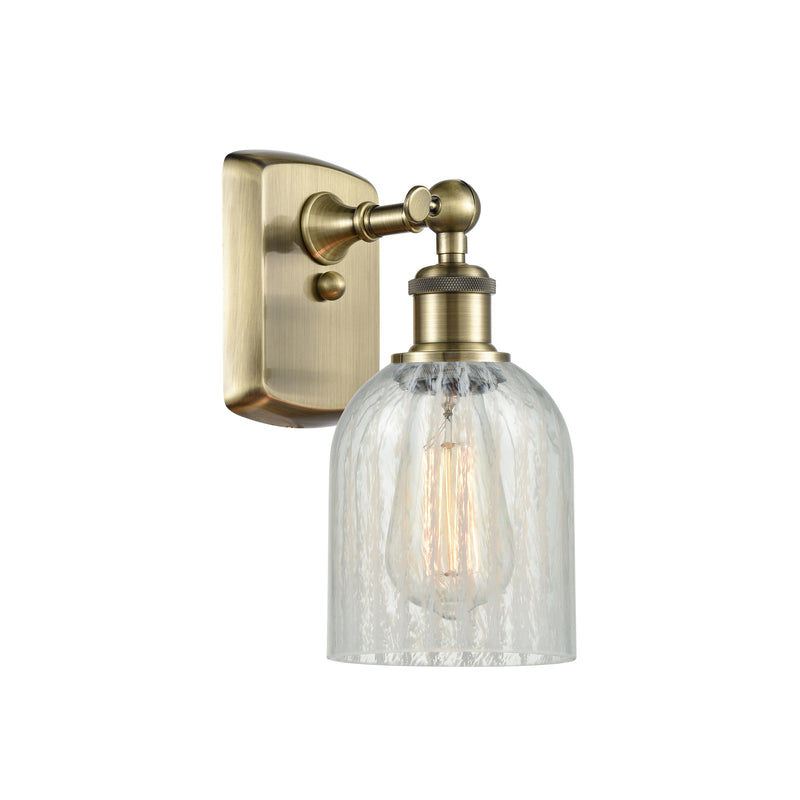 Caledonia Sconce shown in the Antique Brass finish with a Mouchette shade