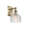 Dayton Sconce shown in the Antique Brass finish with a Clear shade