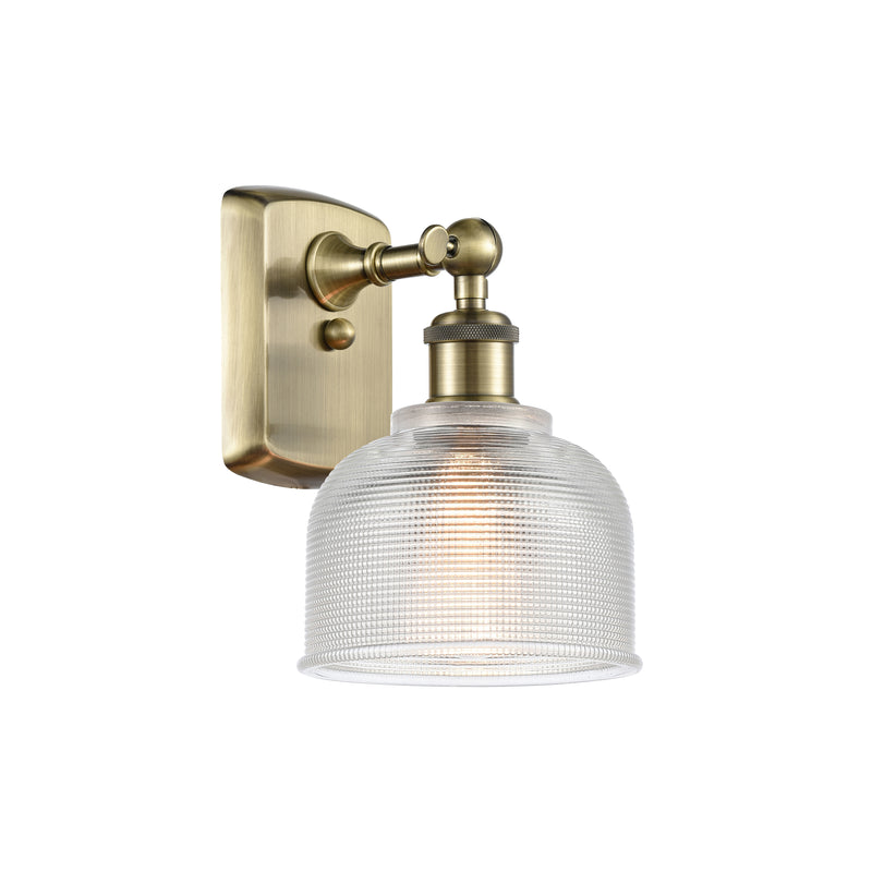 Dayton Sconce shown in the Antique Brass finish with a Clear shade