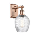 Salina Sconce shown in the Antique Copper finish with a Clear Spiral Fluted shade