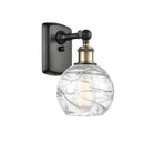 Deco Swirl Sconce shown in the Black Antique Brass finish with a Clear shade