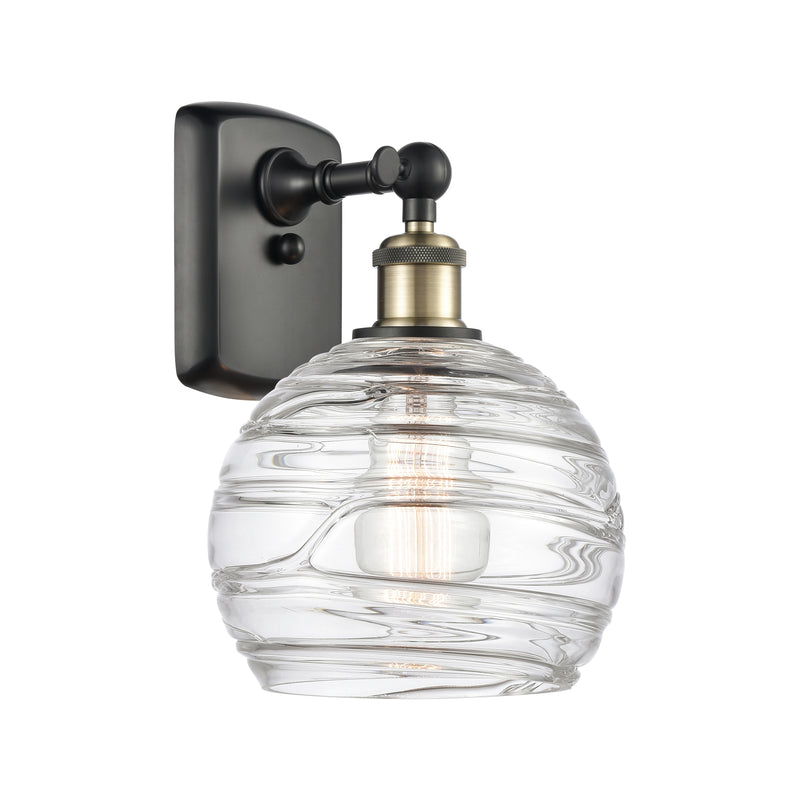 Deco Swirl Sconce shown in the Black Antique Brass finish with a Clear shade