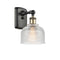 Dayton Sconce shown in the Black Antique Brass finish with a Clear shade