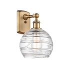 Deco Swirl Sconce shown in the Brushed Brass finish with a Clear shade