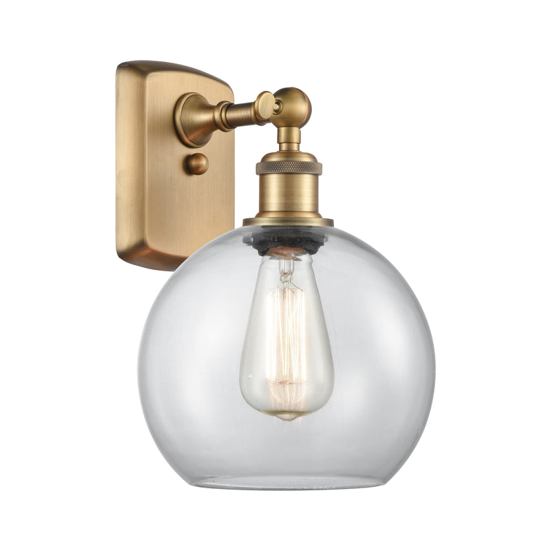 Athens Sconce shown in the Brushed Brass finish with a Clear shade