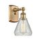 Conesus Sconce shown in the Brushed Brass finish with a Clear Crackle shade