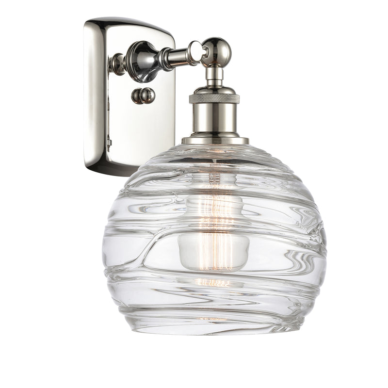 Deco Swirl Sconce shown in the Polished Nickel finish with a Clear shade