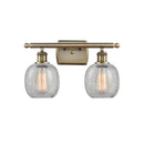 Belfast Bath Vanity Light shown in the Antique Brass finish with a Clear Crackle shade