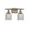 Caledonia Bath Vanity Light shown in the Antique Brass finish with a Charcoal shade