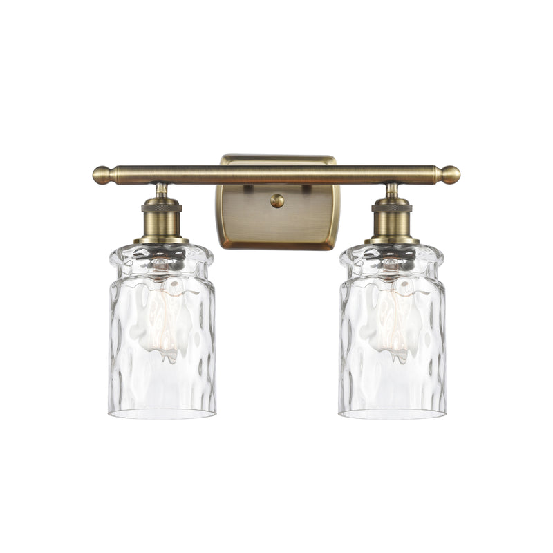 Candor Bath Vanity Light shown in the Antique Brass finish with a Clear Waterglass shade