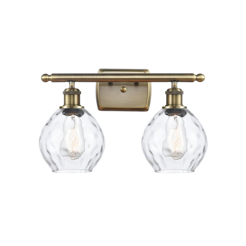 Waverly Bath Vanity Light shown in the Antique Brass finish with a Clear shade