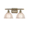 Arietta Bath Vanity Light shown in the Antique Brass finish with a Clear shade