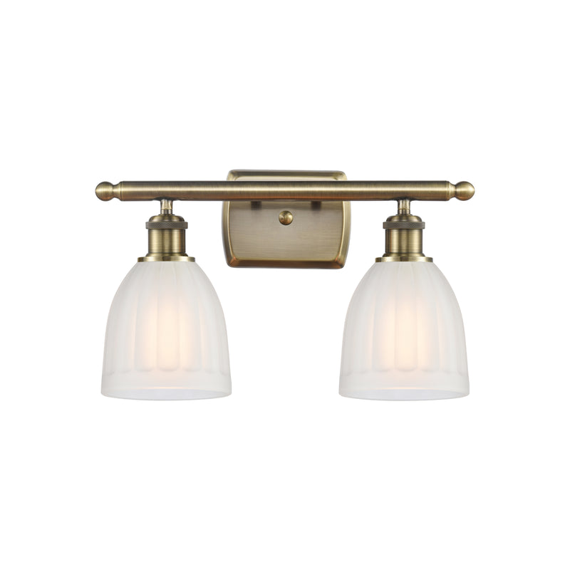 Brookfield Bath Vanity Light shown in the Antique Brass finish with a White shade