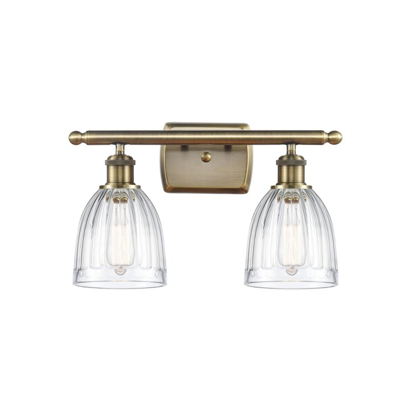 Brookfield Bath Vanity Light shown in the Antique Brass finish with a Clear shade