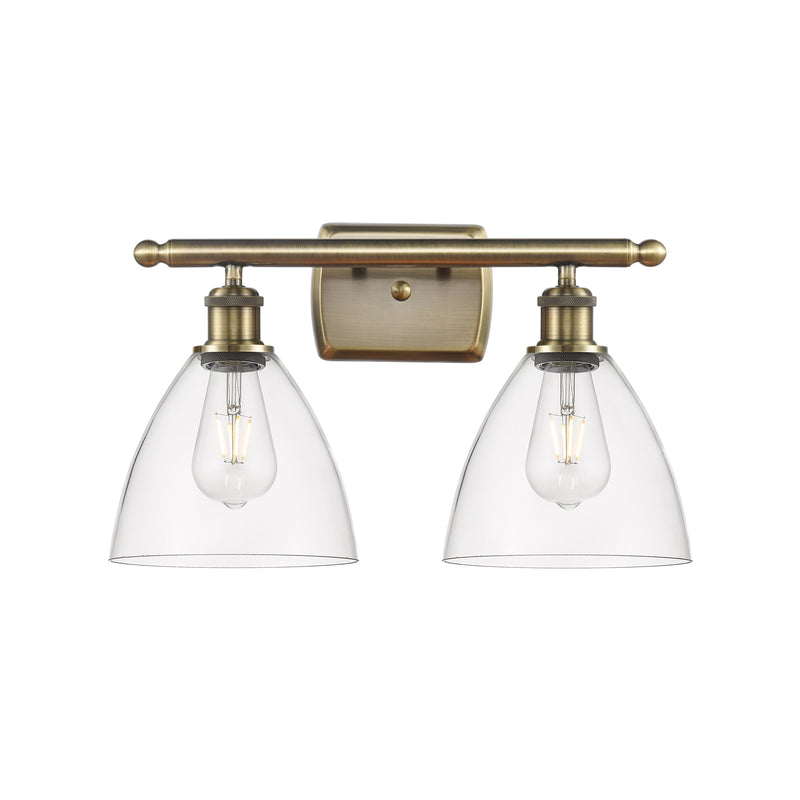 Ballston Dome Bath Vanity Light shown in the Antique Brass finish with a Clear shade