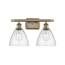 Ballston Dome Bath Vanity Light shown in the Antique Brass finish with a Seedy shade