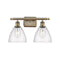 Ballston Dome Bath Vanity Light shown in the Antique Brass finish with a Seedy shade