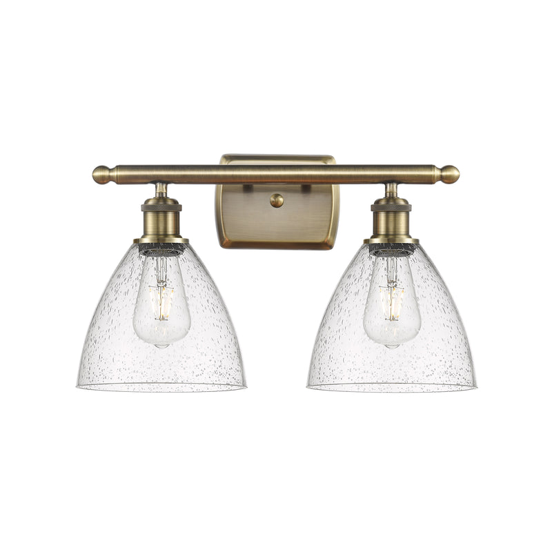 Ballston Dome Bath Vanity Light shown in the Antique Brass finish with a Seedy shade