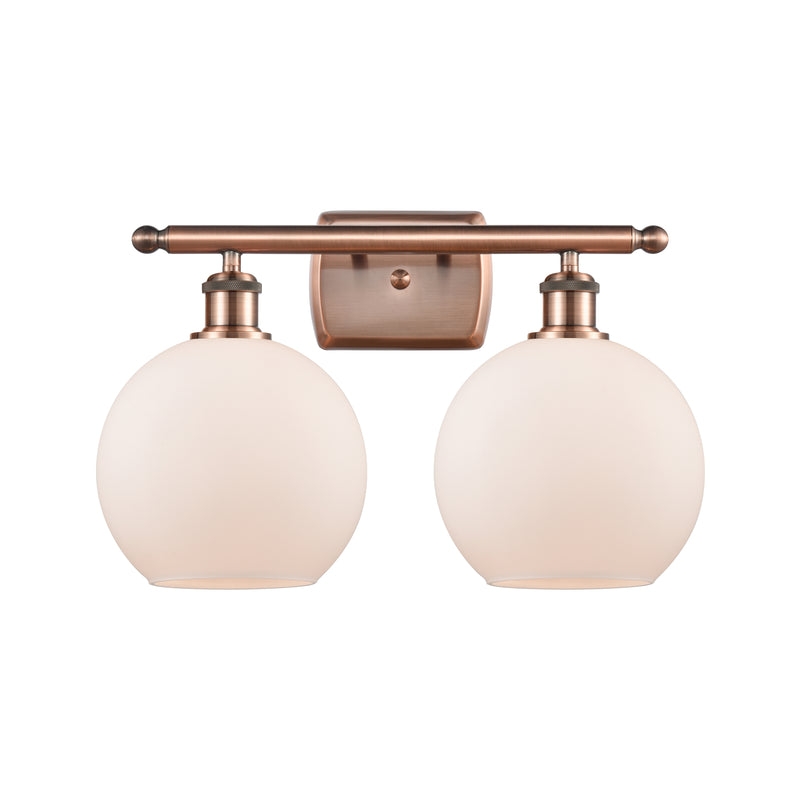 Athens Bath Vanity Light shown in the Antique Copper finish with a Matte White shade