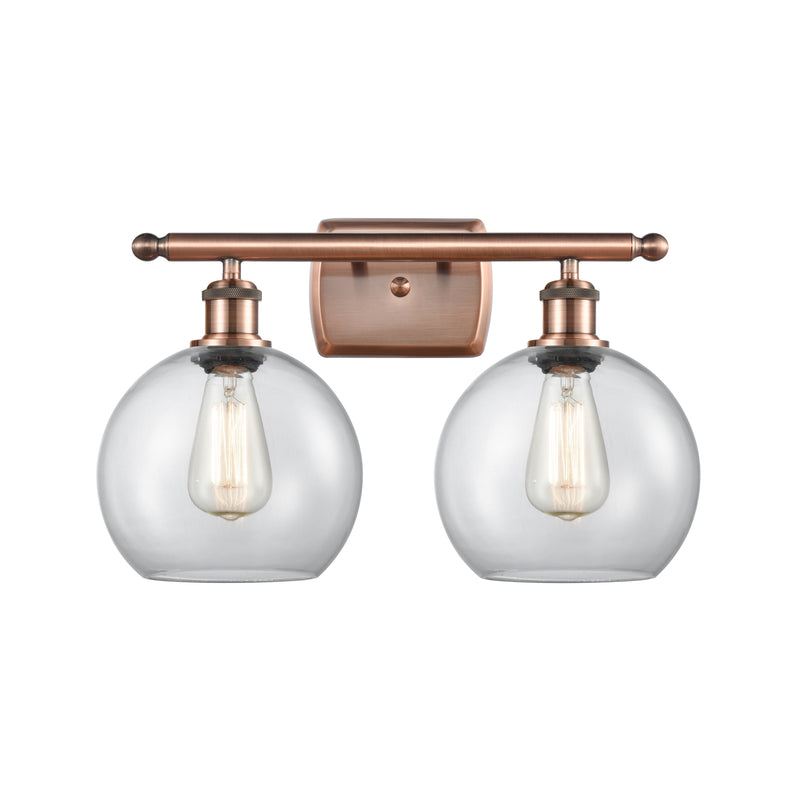 Athens Bath Vanity Light shown in the Antique Copper finish with a Clear shade